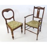 A late 19thC balloon back dining chair. Together with an Arts & Crafts carver chair (2) Please