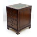 A mahogany leather topped filing cabinet / pedestal . Approx 30" high x 21" wide x 24" deep Please