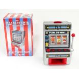 A novelty electronic slot machine (boxed) Please Note - we do not make reference to the condition of