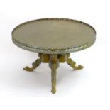 A 20thC table with a circular top and pierced gilt surround above three figural cabriole legs. 30"
