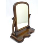 A Victorian mahogany toilet mirror. Approx. 23 1/2" tall Please Note - we do not make reference to