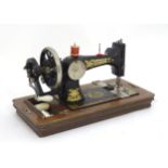A Frister & Rossmann sewing machine, cased Please Note - we do not make reference to the condition