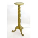 A gold painted torchere on three ball and claw feet, the column with vine decoration. Approx. 43"