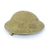 A Second World War / WW2 / WWII army helmet with strap Please Note - we do not make reference to the