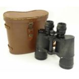 A pair of mid 20thC Omega 7x50 binoculars, with leather strap and case Please Note - we do not