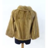 A small short fur coat, together with a fur stole (2) Please Note - we do not make reference to