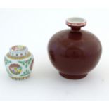 A Chinese sang de boeuf bulbous vase. Character marks under. Together with a Doucai style pot and