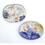 Two Chinese export famille rose serving plates decorated in the tobacco leaf pattern with exotic