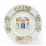 A Chinese export armorial plate decorated with the arms of Arbuthnott, Scotland, above the Latin