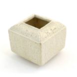 A small Chinese pot of squared form with incised geometric detail. Character marks under. Approx.
