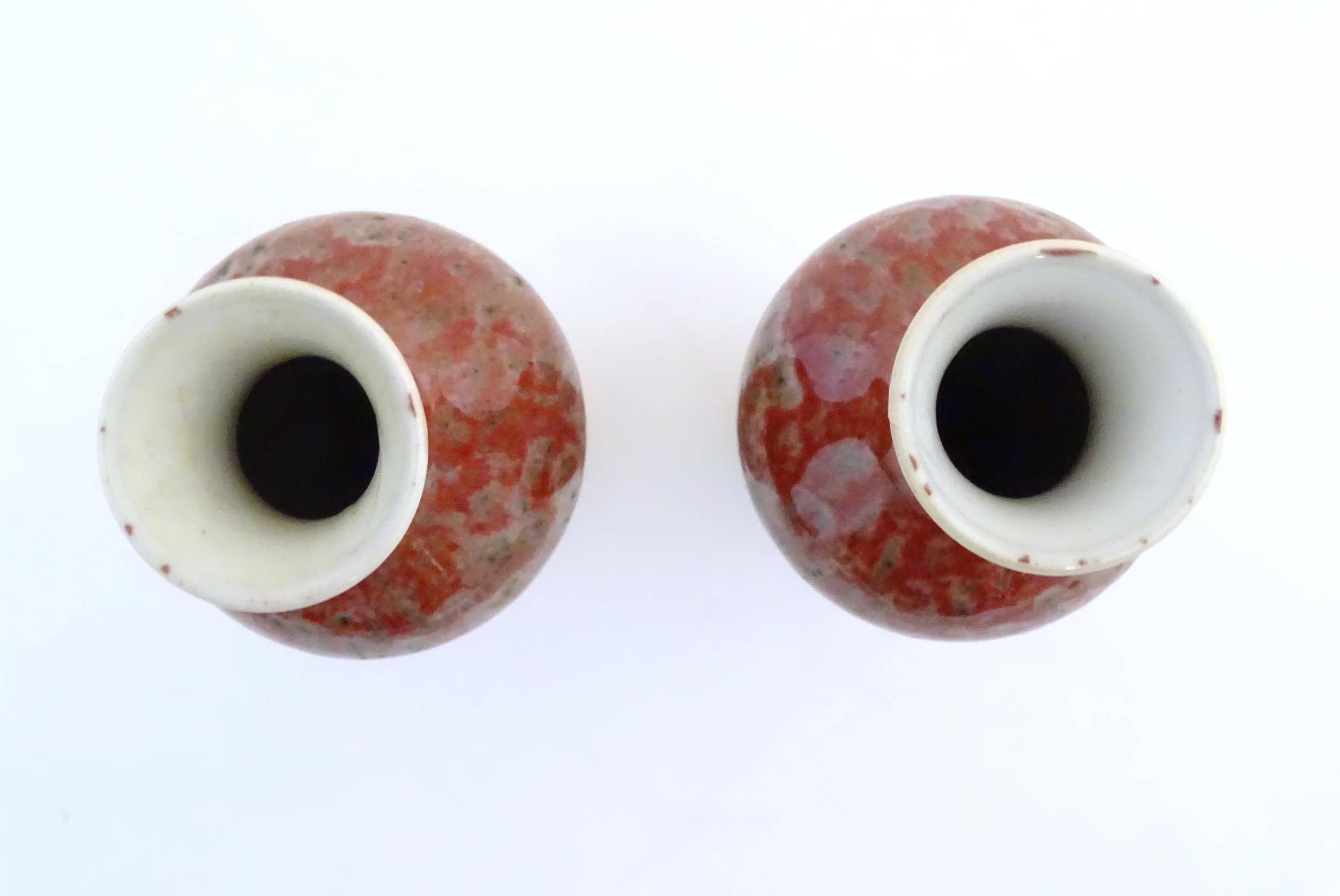 A pair of Chinese vases of elongated form decorated with a mottled glaze. Double ring mark under. - Image 6 of 8
