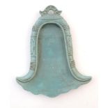 A Chinese incense holder / dish of stylised bell form with relief temple bell style decoration.