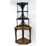 A late 19thC Aesthetic movement corner display cabinet, the top section having turned supports and