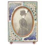 A Victorian photograph frame, the wooden surround with micro mosaic flower decoration and oval