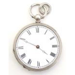 A white metal pocket watch. Approx. 1 1/2" diameter Please Note - we do not make reference to the