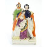 A Victorian Staffordshire pottery flat back figural group depicting The Royal Family, with Queen