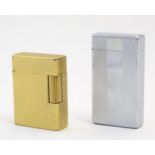 An S. T. Dupont Ligne 1 lighter, serial number DH7771, together with a Colibri molectric lighter,