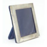 An easel back photograph frame with silver surround, hallmarked London 2003, maker Kitney & Co.