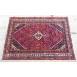 Carpet / Rug : A Hamadan carpet with red, cream and blue ground with floral, foliate and geometric