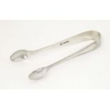 Silver sugar tongs, hallmarked Sheffield 1927, maker Cooper Brothers & Sons Ltd. Approx. 4" long