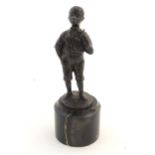 A 20thC cast figure of a black boy smoking a pipe. Signed R. Moret. On a marble base. Approx. 5 1/2"