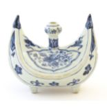 A Chinese blue and white pilgrim's flask of crescent form decorated with a stylised phoenix bird,