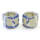 Two Chinese pot pourri holders of hexagonal form with blue and white foliate decoration and