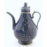 A Chinese pear shaped teapot with phoenix bird decoration to body. Approx. 8 3/4" high Please Note -