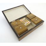 Toys: A late Victorian walnut games box, the hinged lid with inlaid playing cards, opening to reveal
