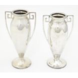 Two silver pedestal vases of urn form with Greek Key style handles, hallmarked Birmingham 1917,