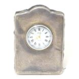 An easel back clock with silver front Hallmarked Sheffield 1997 maker Carrs of Sheffield Ltd. 3 1/2"