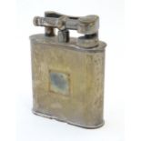 A mid 20thC silver plated table lighter by Dunhill, stamped underside Regd Design no 737418 , Patent
