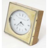 A desk clock with silver surround hallmarked London 1988 maker TP and engraved Asprey. The clock