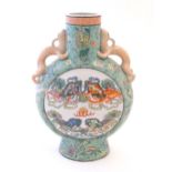 A Chinese moon vase with twin handles of stylised salamander form, the body decorated with Foo dogs,