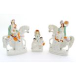 Three Victorian Staffordshire figures depicting male and female Scottish figures on horseback, and a