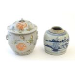A Chinese lidded pot decorated with stylised bird roundels surrounded by butterflies. Together