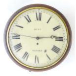 A mahogany wall clock with 12" enamel dial signed Hunt Oxford behind convex glass. Please Note -