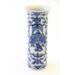 A Chinese blue and white vase of cylindrical form decorated with an Imperial court scene with