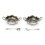 A pair of silver salts with twin handles hallmarked Sheffield 1903 maker Walker & Hall, with 2