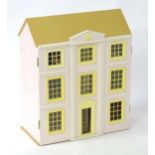 Toy: A late 20thC wooden Doll's House, with nine rooms over three floors, in painted pink with