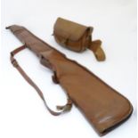 Shooting: a late 20thC brown leather gun slip and cartridge bag, the slip approximately 48" long