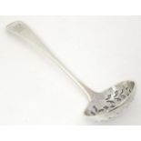 A George III silver Old English pattern sifting spoon, hallmarked London 1811, maker Thomas Wallis &