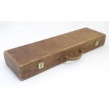 Shooting: a Browning tan leather shotgun motor case, the fitted interior with baize and sheepskin