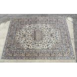 Carpet / Rug : A Kashan carpet with cream / beige ground decorated with floral and folate detail.