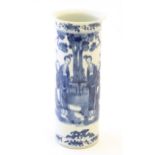 A Chinese blue and white vase of cylindrical form decorated with figures in a garden landscape