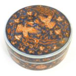 A Chinese lidded pot of circular form decorated with phoenix birds amongst stylised clouds. The