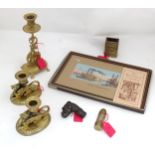 A quantity of assorted brass items to include a candlesticks, match box keep, trenchart lighter of