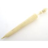 A 19thC bone needle case modelled as an umbrella. Approx. 4 1/4" Please Note - we do not make