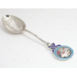 A silver commemorative Coronation teaspoon for King George V and Queen Mary, the handle surmounted