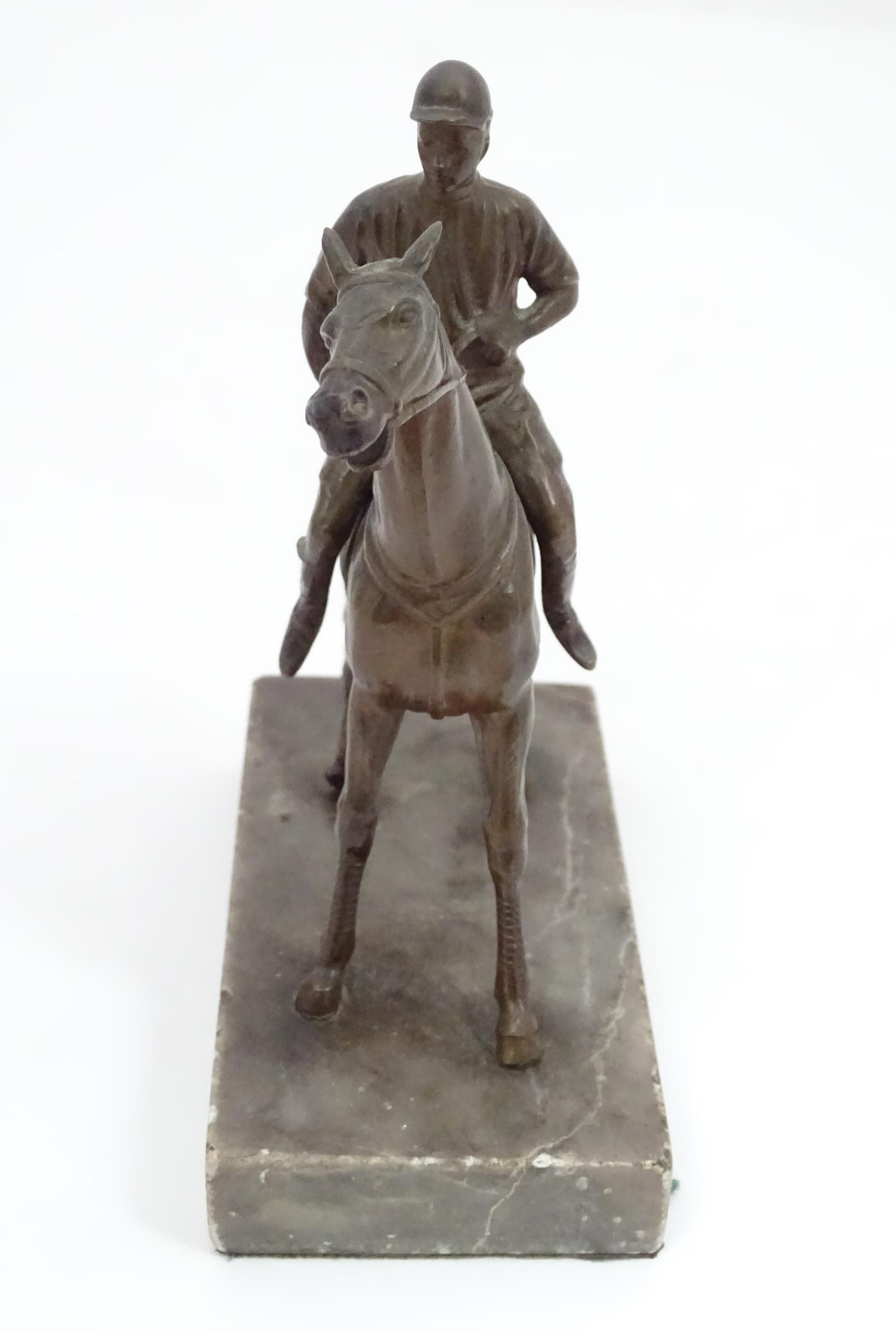 A 20thC cast sculpture modelled as a jockey on horseback, upon a marble base. Approx. 5 1/2" high - Image 5 of 5